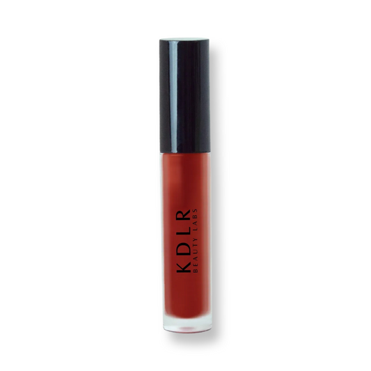 KDLR Beauty Labs' Power Drip Lip Gloss, showcasing radiant shine, full lips in shimmer and natural finishes, perfect for versatile, luxurious day-to-night lip makeup. Variant: Crimson, deep red.
