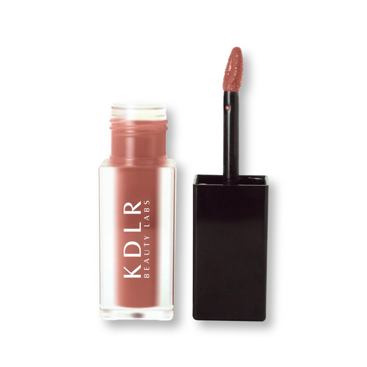 KDLR Beauty Labs' SatinMatte Lip Stain, featuring enduring color with a velvety matte finish for all-day wear, buildable shades, unique doe-shaped applicator, vitamin E enriched, and an eco-friendly, vegan formula. Variant: Dusty Pear