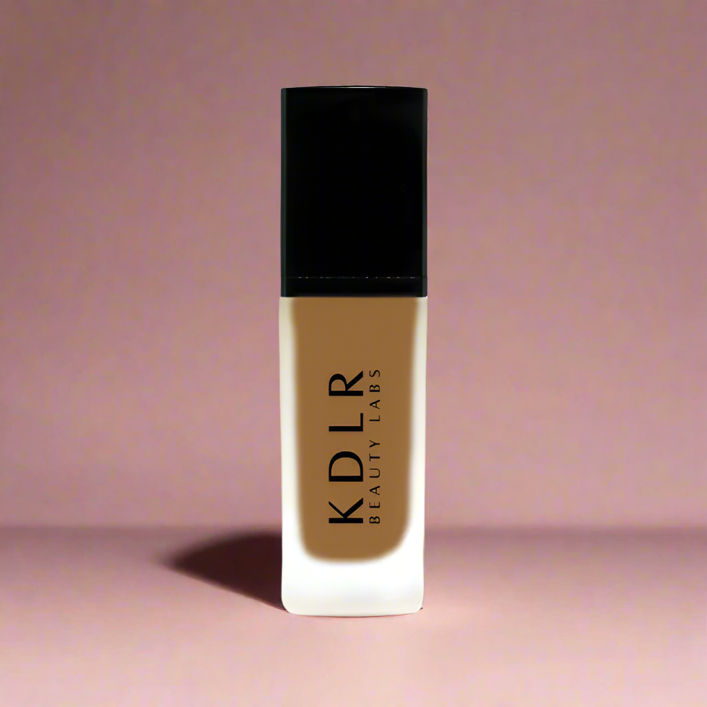 KDLR Beauty SPF Foundation Liquid Bottle Image - High Coverage Makeup. Variant: Maple