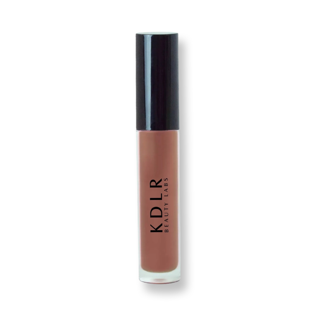 KDLR Beauty Labs' Power Drip Lip Gloss, showcasing radiant shine, full lips in shimmer and natural finishes, perfect for versatile, luxurious day-to-night lip makeup. Variant: Hot Chocolate