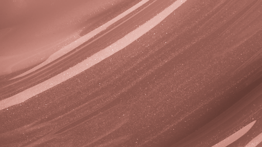 Swatch of KDLR Beauty Labs' Power Drip Lip Gloss, showcasing radiant shine, full lips in shimmer and natural finishes, perfect for versatile, luxurious day-to-night lip makeup Variant: Bare