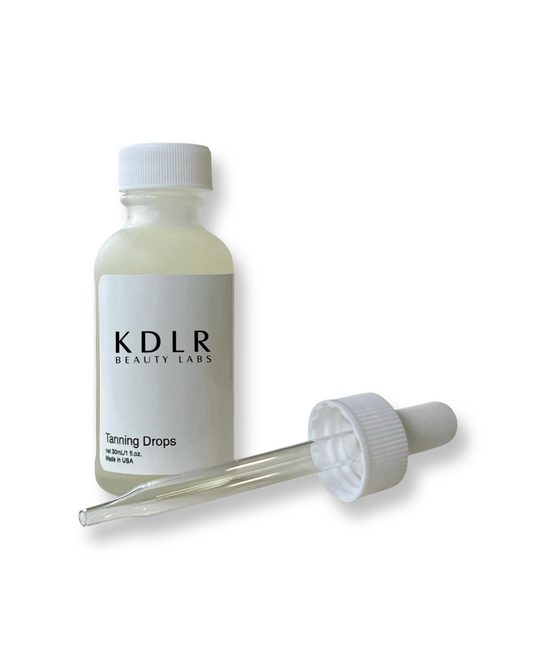 KDLR Beauty Labs tanning drops bottle for radiant summer skin.