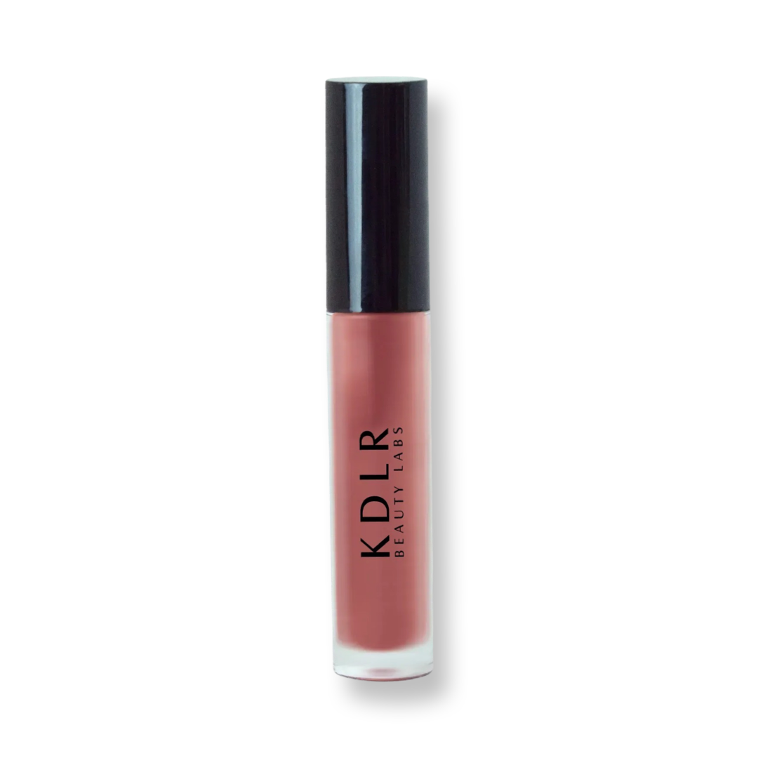 KDLR Beauty Labs' Power Drip Lip Gloss, showcasing radiant shine, full lips in shimmer and natural finishes, perfect for versatile, luxurious day-to-night lip makeup. Variant: Warm Rose