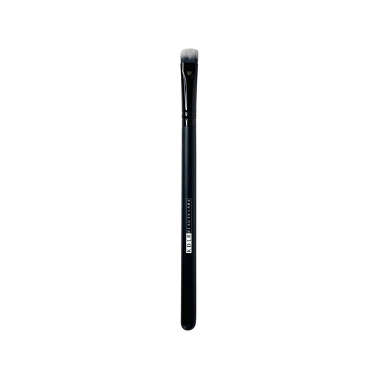KDLR Beauty Labs Flat Pack and Layer brush, a flat, firm synthetic eyeshadow packing and lid shading brush with black and white bristles and a glossy black handle on a white background.