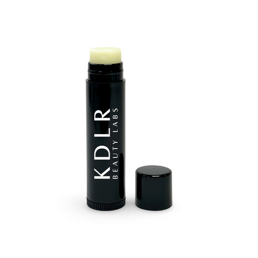 KDLR Beauty Labs Vegan Lip Balm in a small, convenient tube, ideal for nourishing and moisturizing lips on the go.