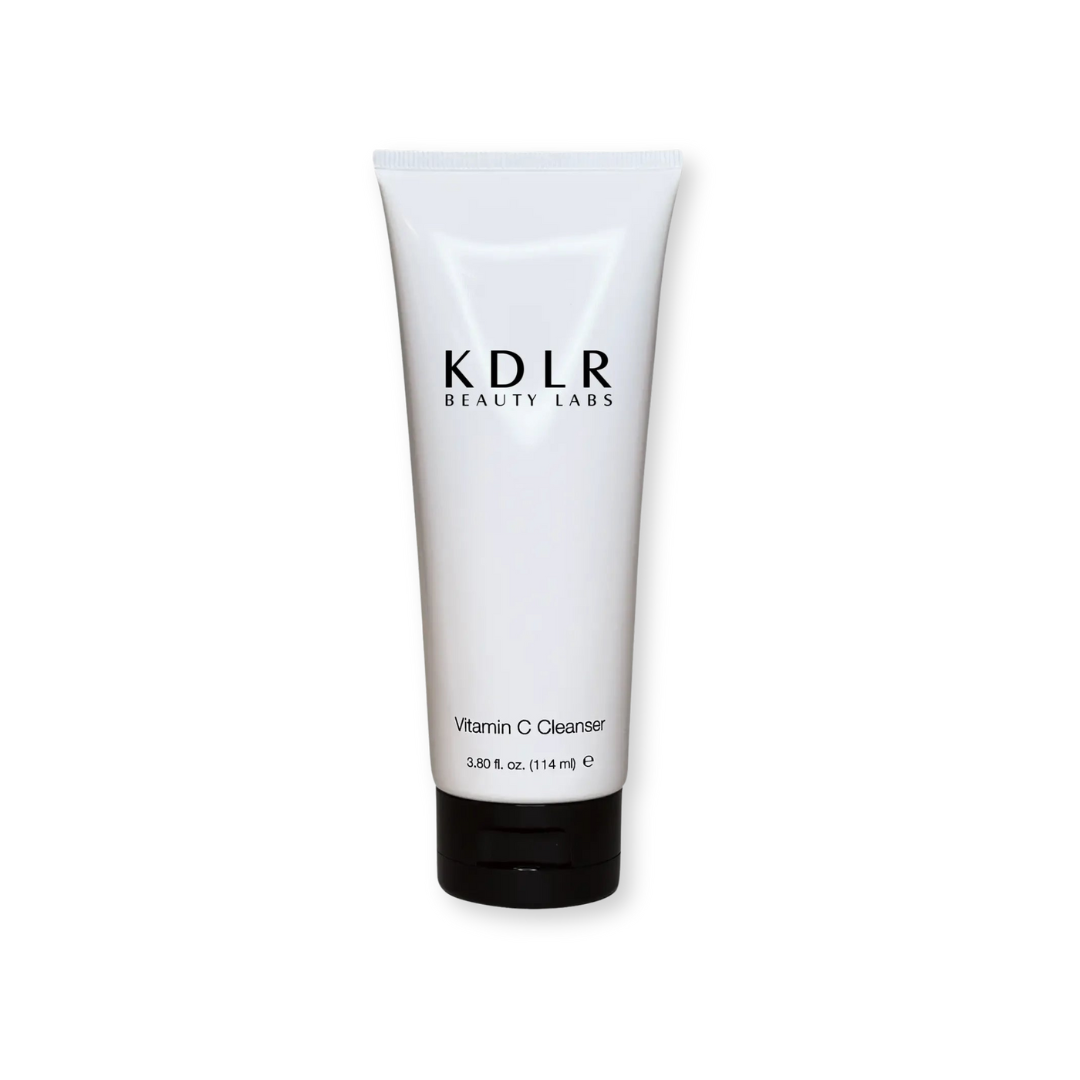 Vitamin C Cleanser by KDLR Beauty Labs, featuring a sleek white bottle with a pump dispenser, labeled with a simple and elegant design showcasing its key ingredients.