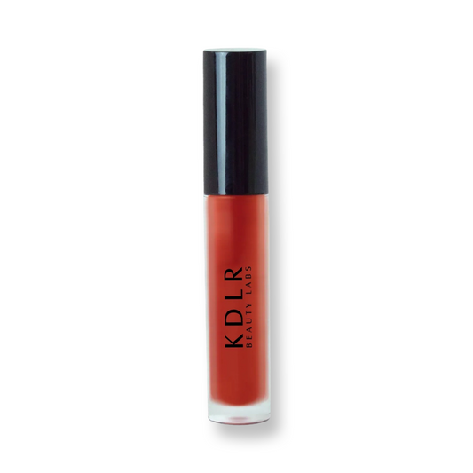 KDLR Beauty Labs' Power Drip Lip Gloss, showcasing radiant shine, full lips in shimmer and natural finishes, perfect for versatile, luxurious day-to-night lip makeup. Variant: Crimson