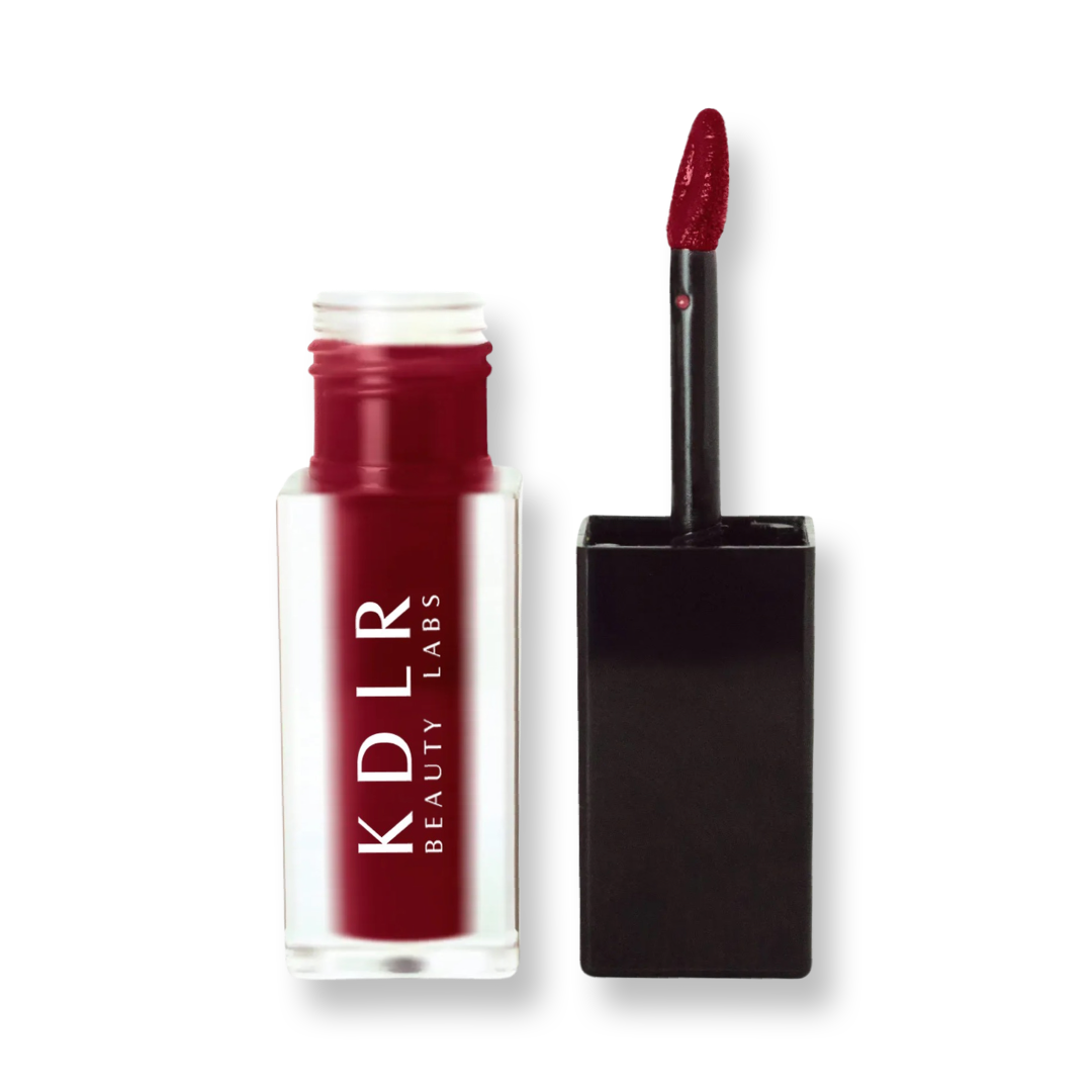 KDLR Beauty Labs' SatinMatte Lip Stain, featuring enduring color with a velvety matte finish for all-day wear, buildable shades, unique doe-shaped applicator, vitamin E enriched, and an eco-friendly, vegan formula. Variant: Dark Sienna