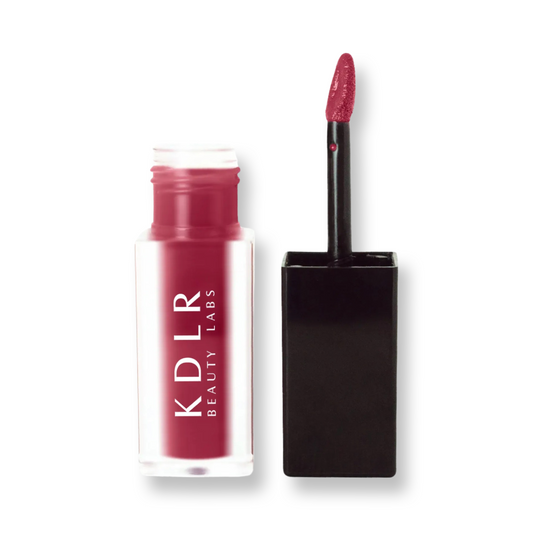 KDLR Beauty Labs' SatinMatte Lip Stain, featuring enduring color with a velvety matte finish for all-day wear, buildable shades, unique doe-shaped applicator, vitamin E enriched, and an eco-friendly, vegan formula. Variant: Deep Burgundy