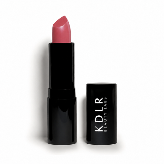 KDLR Beauty Labs Noir Patent Cream Lipstick in Darling Dahlia, a creamy rosy pink lipstick with a satin finish in glossy black packaging on a white studio background.