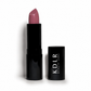 KDLR Beauty Labs Noir Patent Cream Lipstick in Magical Mauve, a creamy mauve nude satin lipstick in glossy black packaging on a white studio background.