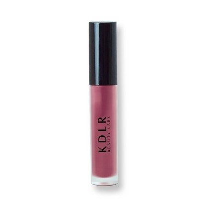 KDLR Beauty Labs' Power Drip Lip Gloss, showcasing radiant shine, full lips in shimmer and natural finishes, perfect for versatile, luxurious day-to-night lip makeup. Variant: Lavendar