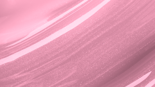 Swatch of KDLR Beauty Labs' Power Drip Lip Gloss, showcasing radiant shine, full lips in shimmer and natural finishes, perfect for versatile, luxurious day-to-night lip makeup. Variant: Pinky