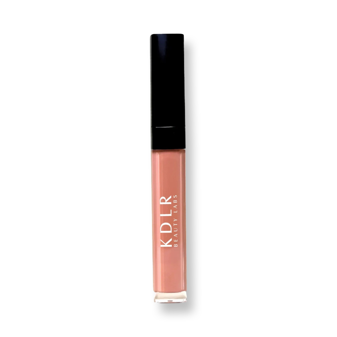 Close-up of Glow Infusion Lip Oil by KDLR Beauty Labs, showcasing its hydrating shimmer and elegant packaging. Variant: Fun and Games. A sheer tan sheen.