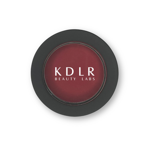 KDLR Beauty Labs Power Flush Powder Blush in Raspberry — rich berry pressed powder blush for bold radiant color on deep skin.