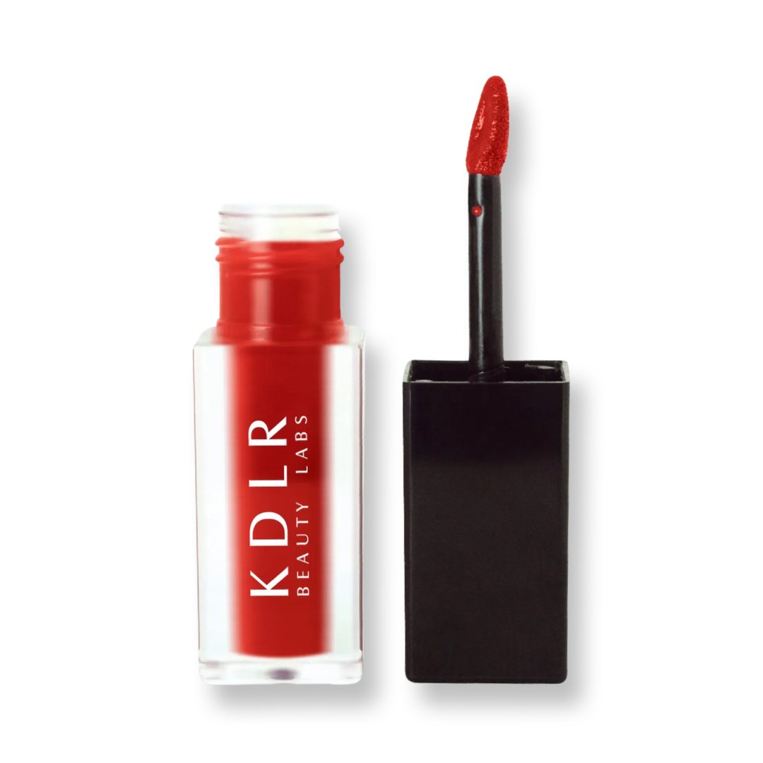 KDLR Beauty Labs' SatinMatte Lip Stain, featuring enduring color with a velvety matte finish for all-day wear, buildable shades, unique doe-shaped applicator, vitamin E enriched, and an eco-friendly, vegan formula. Variant: True Crimson