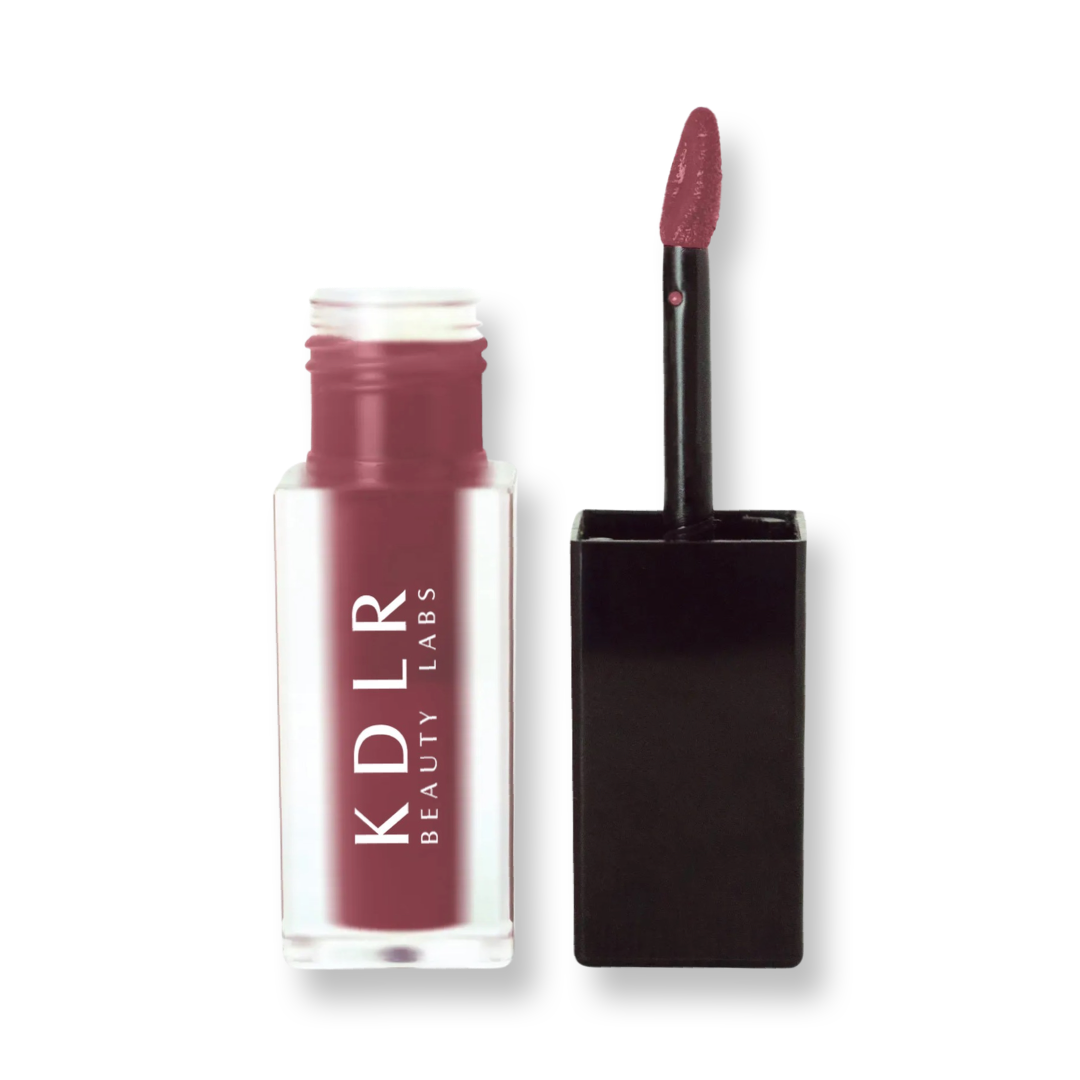 KDLR Beauty Labs' SatinMatte Lip Stain, featuring enduring color with a velvety matte finish for all-day wear, buildable shades, unique doe-shaped applicator, vitamin E enriched, and an eco-friendly, vegan formula. Variant: Twilight