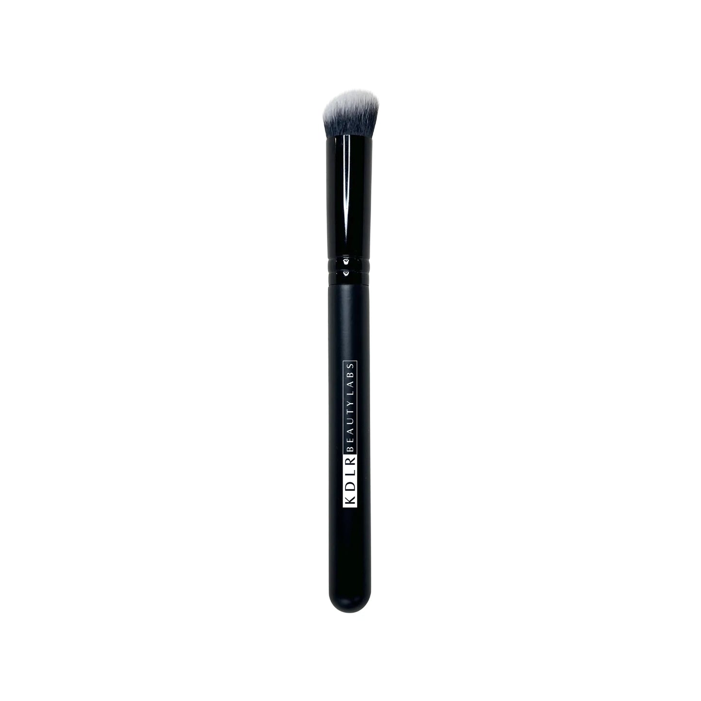 KDLR Beauty Labs Angled Conceal and Blur brush, a dense, slanted synthetic under-eye concealer buffing brush with black and white bristles and a glossy black handle on a white background.